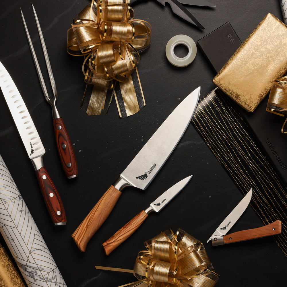 Example of knives with engrave logos. The knives have wooden handles on a dark surface with gold ribbons.