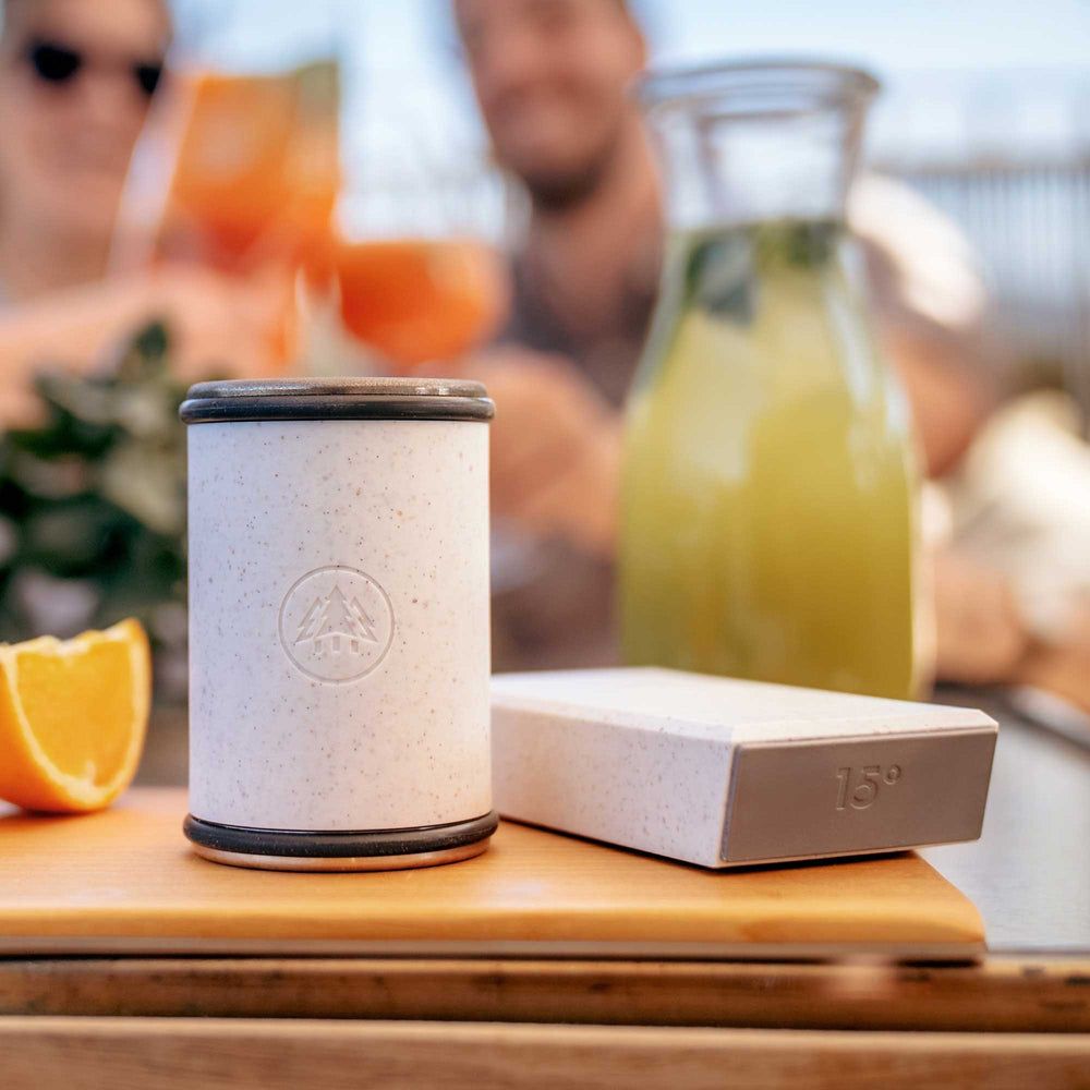 Horl Cruise Sharpener Kit with Sharpening Cylinder and Magnet Holder in Cruise White Color on a wooden surface with a blurred background with people.