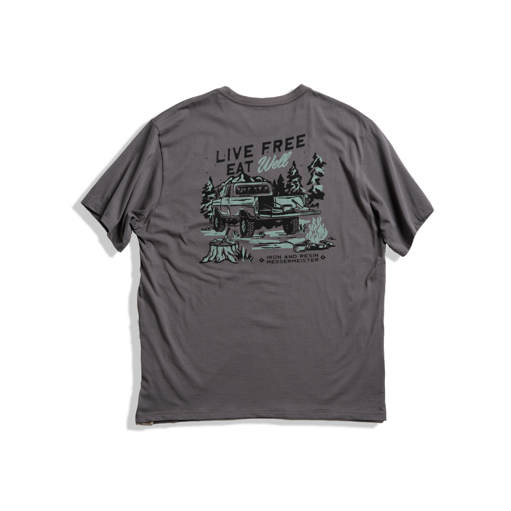 Messermeister x INR 4X4 Pocket Tee - Charcoal - 100% Organic Cotton with "live well, eat free", a truck and some trees on a plain background