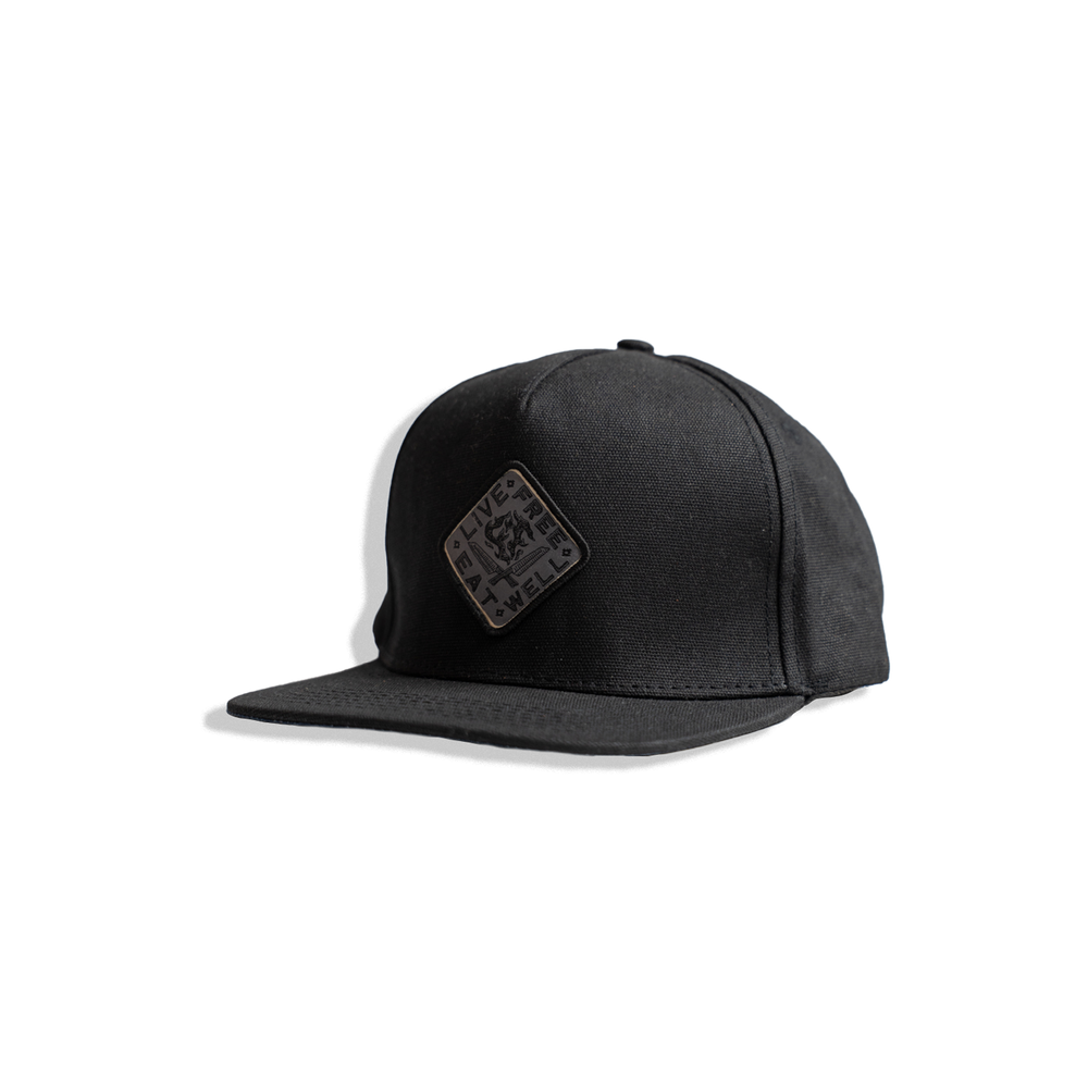 black waxed canvas hat with INR x Messermeister "live free eat well"
