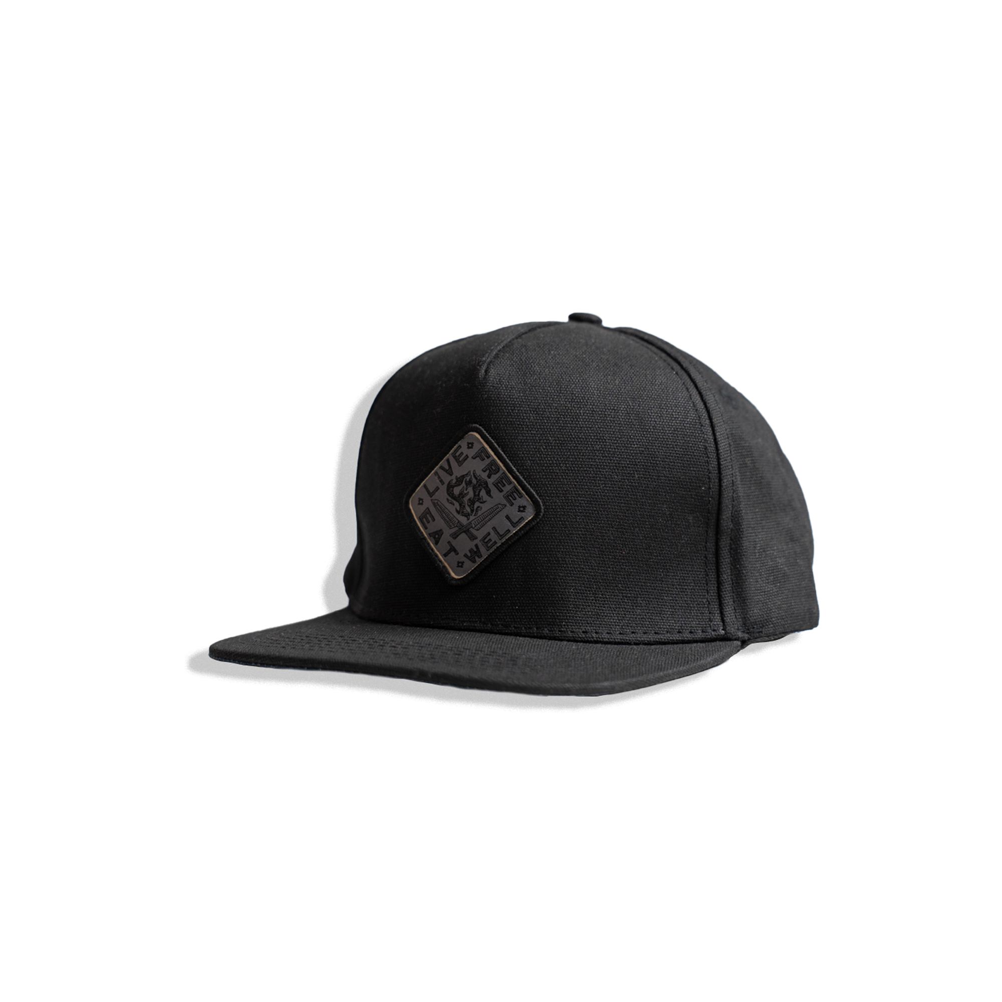black waxed canvas hat with INR x Messermeister "live free eat well"