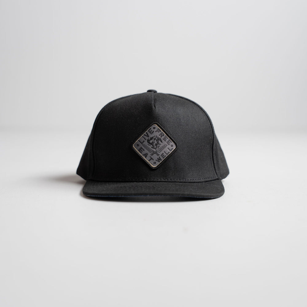 Messermeister x INR Hat - Black - Durable Waxed Canvas on a white background
