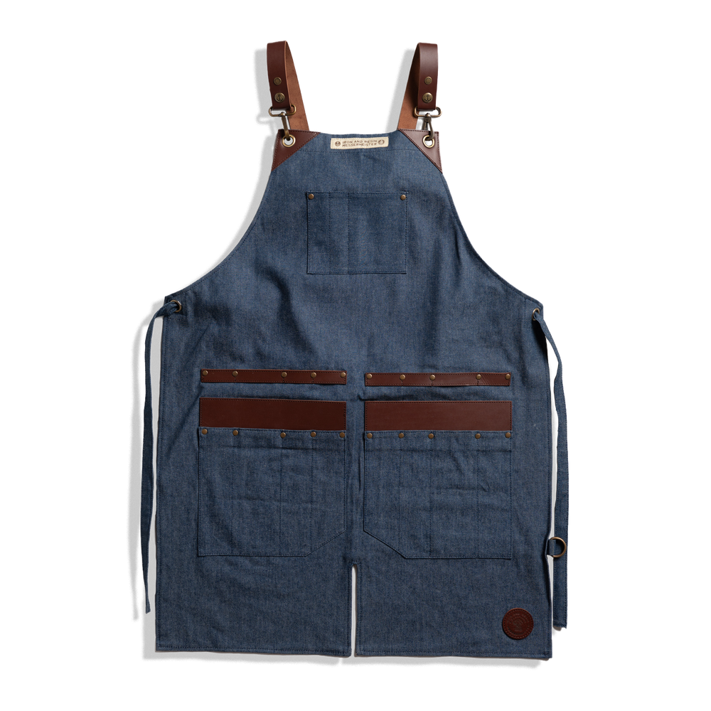 Messermeister x INR Denim Apron-Knife Roll Hybrid laid out on a plain background