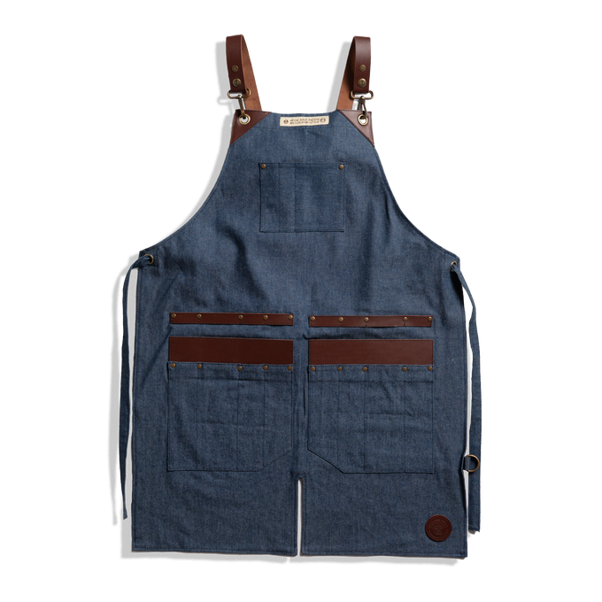 Messermeister x INR Denim Apron-Knife Roll Hybrid laid out on a plain background