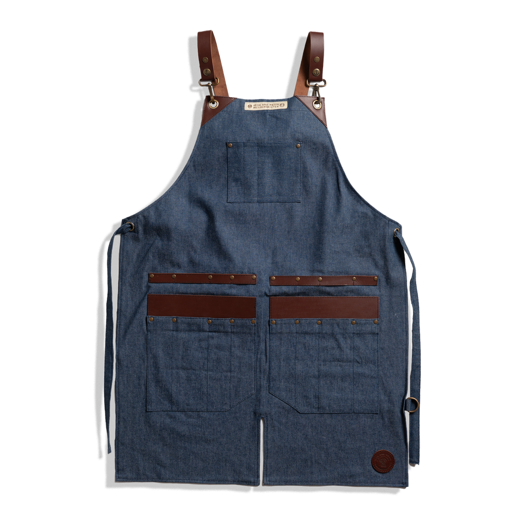 Messermeister x INR Denim Apron-Knife Roll Hybrid laid out on a plain background