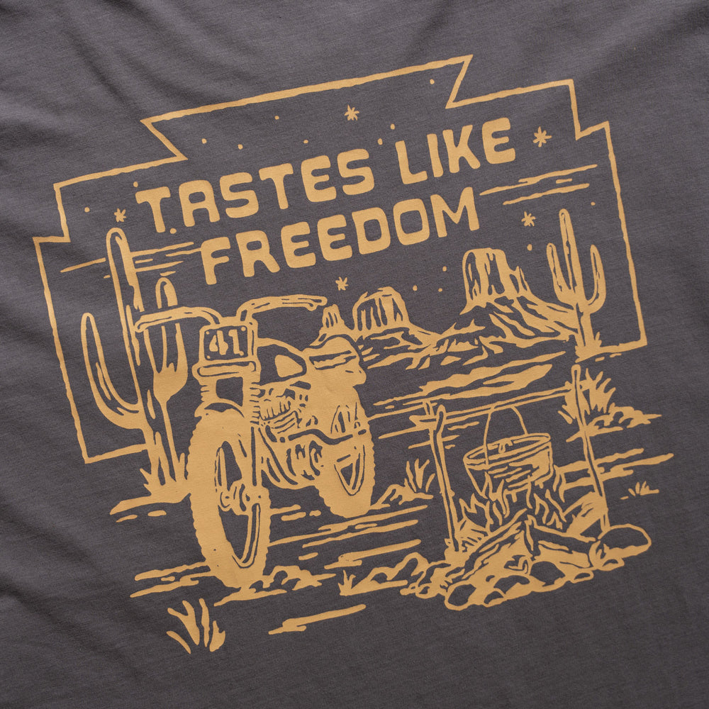 Motorcycle in the desert "tastes like freedom" yellow logo