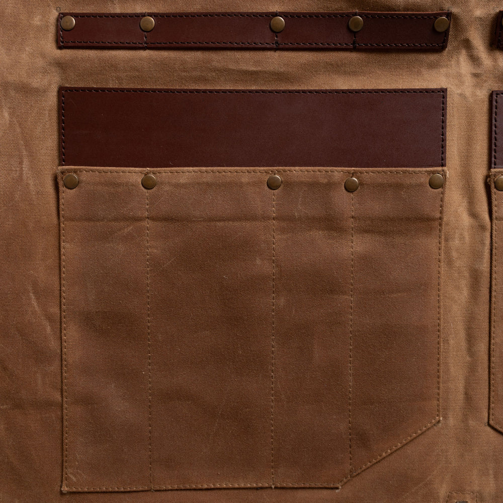 close up on the knife pockets on the apron/roll