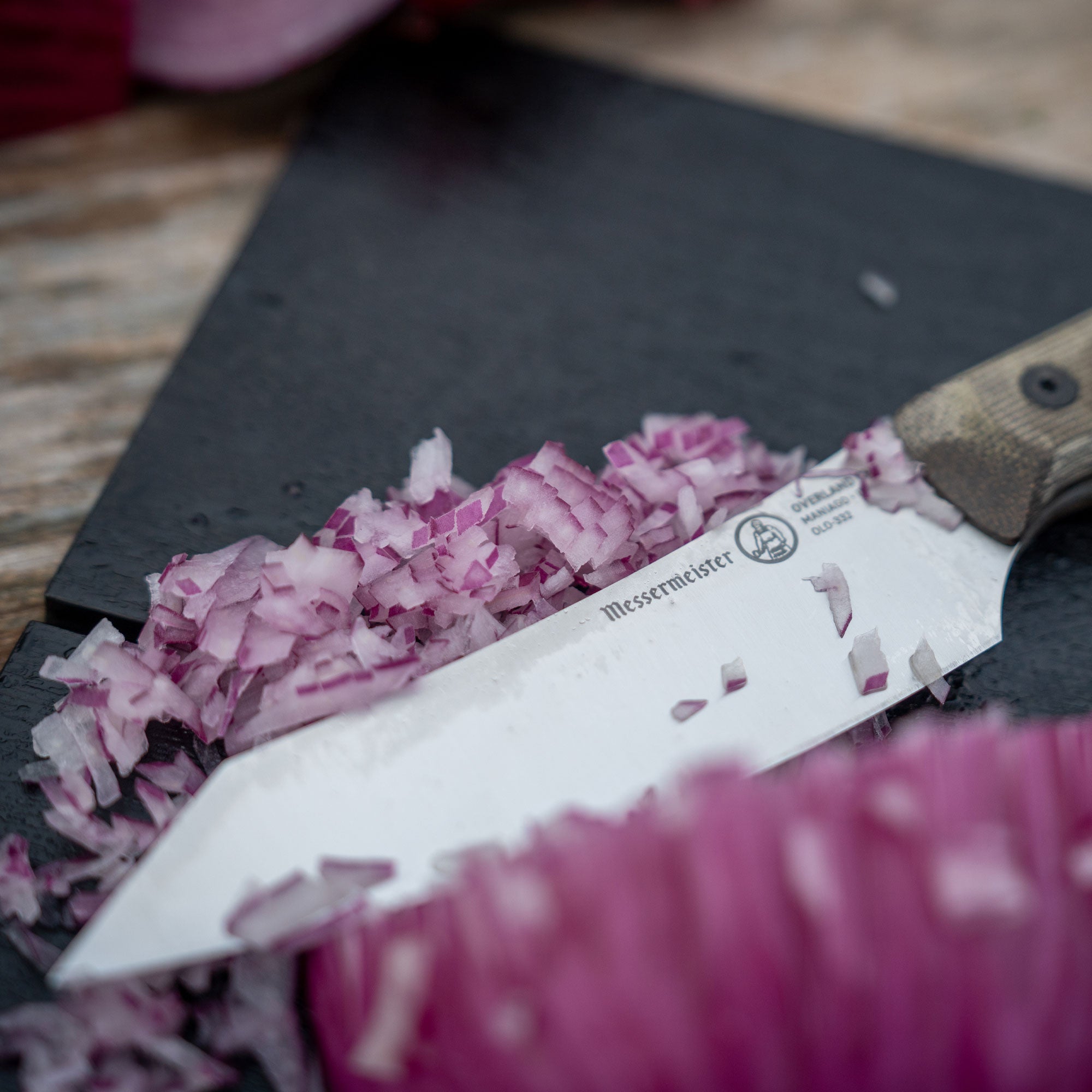 Messermeister Overland Chef Utility Knife with Chopped Onions on a Adventure Chef Folding Cutting Board