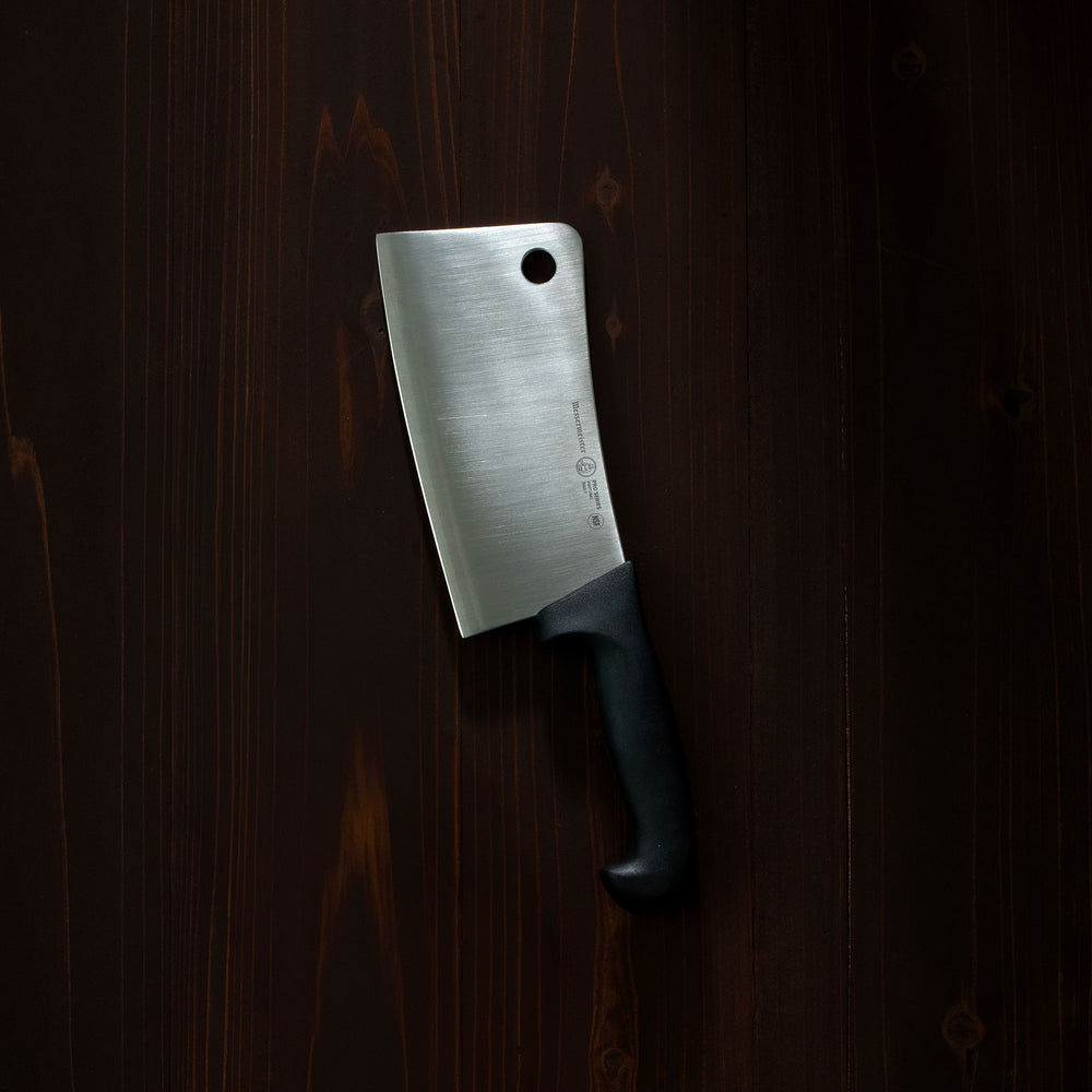Messermeister Pro Series Cleaver on a dark wood background