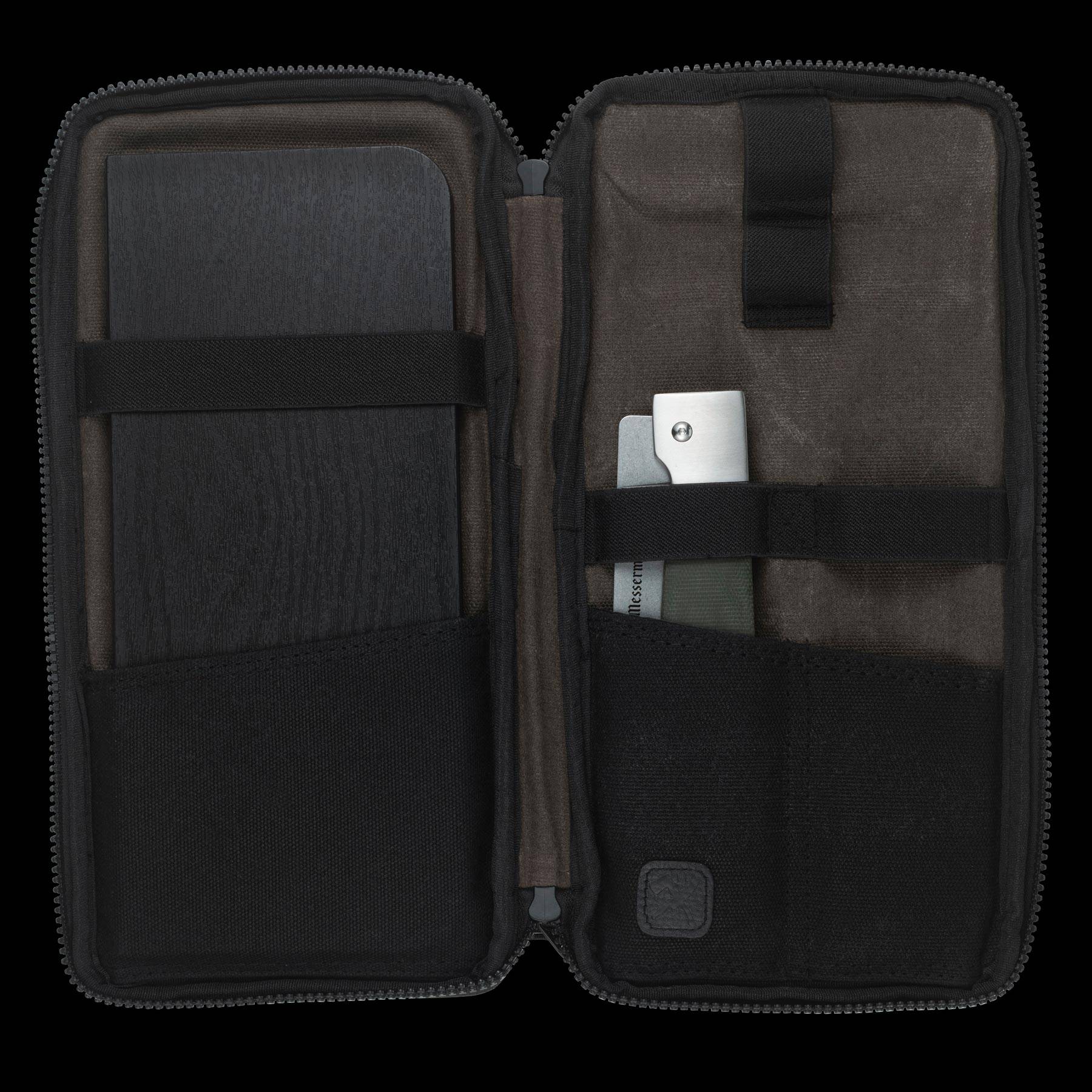 Messermeister Adventure Chef Linen Basecamp Set 3 Piece showing the 6 inch folding Chef's Knife and faux wood cutting board tucked inside the zippered carrying case