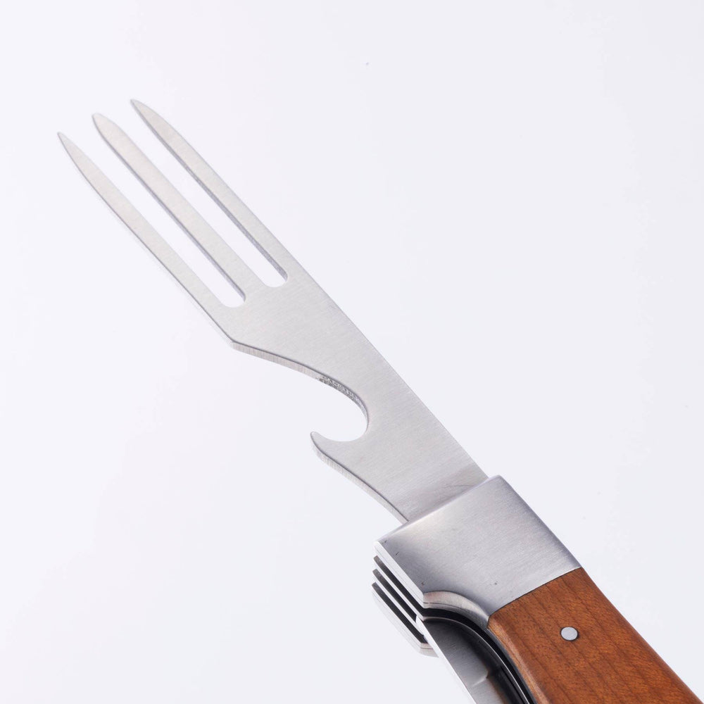 A close up view of the fork with bottle opener on the Messermeister Adventure Chef Maple Folding Camp Utensil.