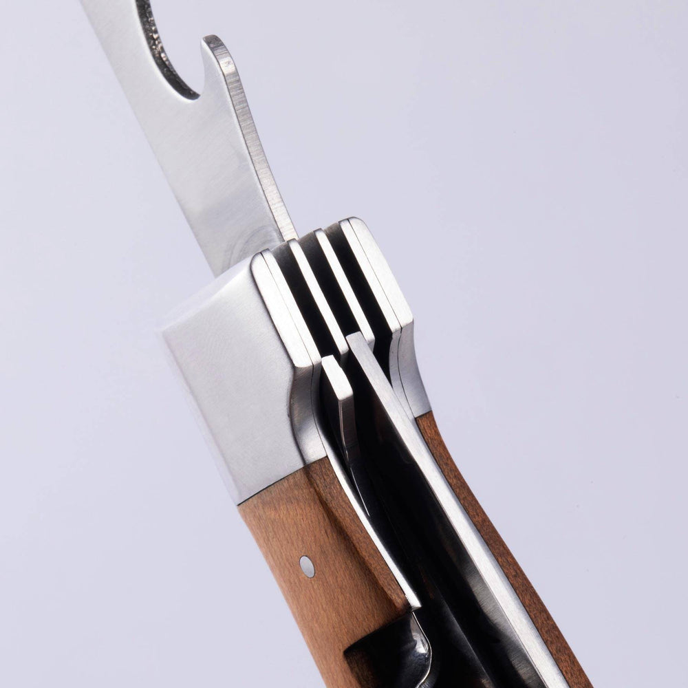 A close up view of the locking mechanism in the handle of the Messermeister Adventure Chef Maple Folding Camp Utensil.
