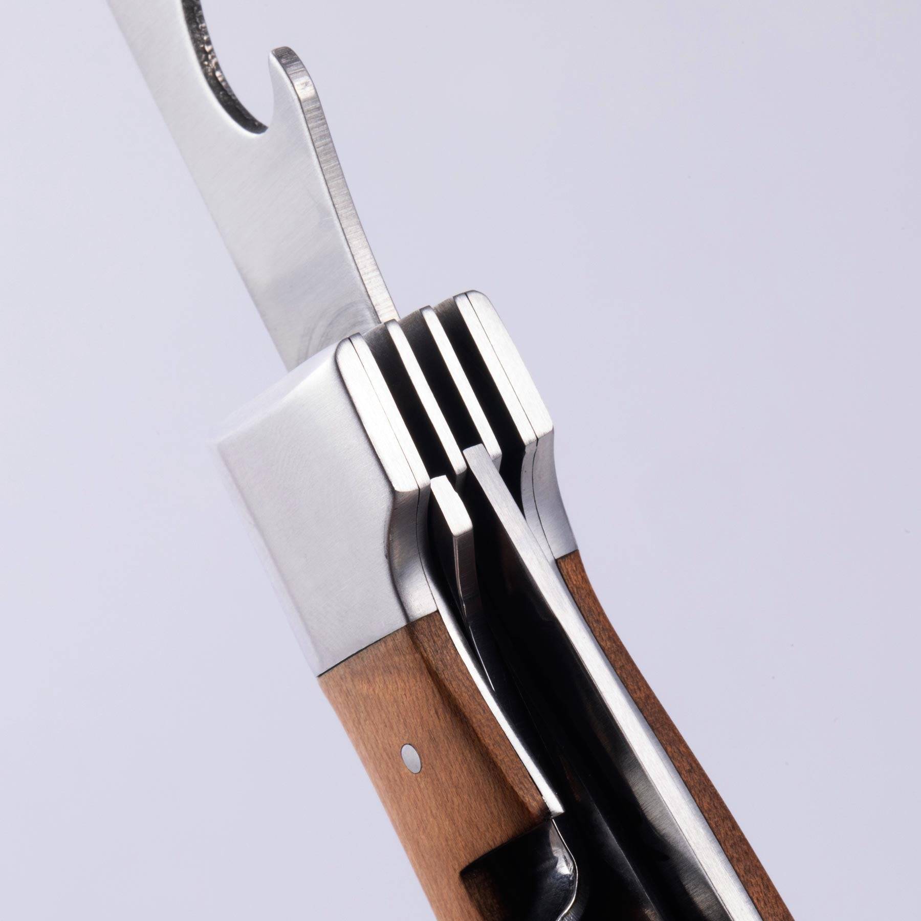 A close up view of the locking mechanism in the handle of the Messermeister Adventure Chef Maple Folding Camp Utensil.
