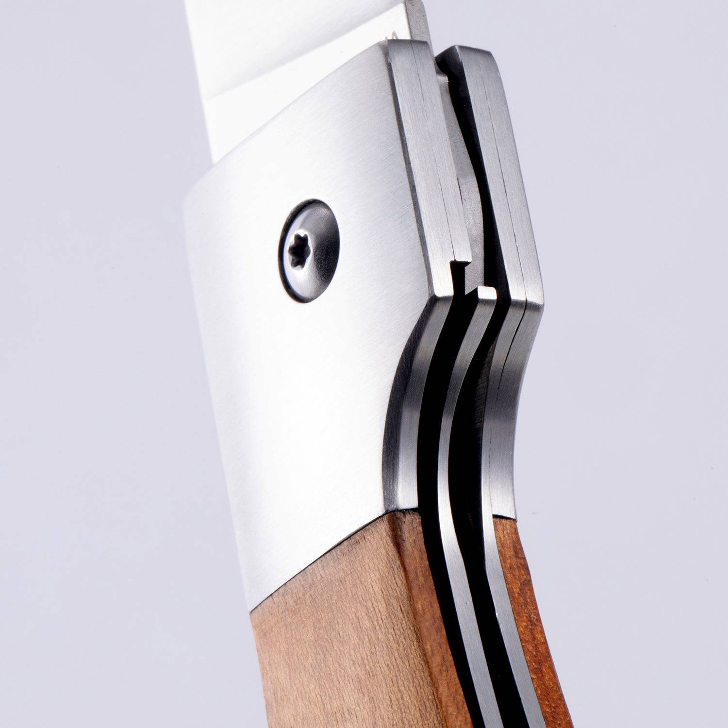 A close up view of the locking mechanism on the Messermeister Adventure Chef Folding 6 inch Fillet Knife 