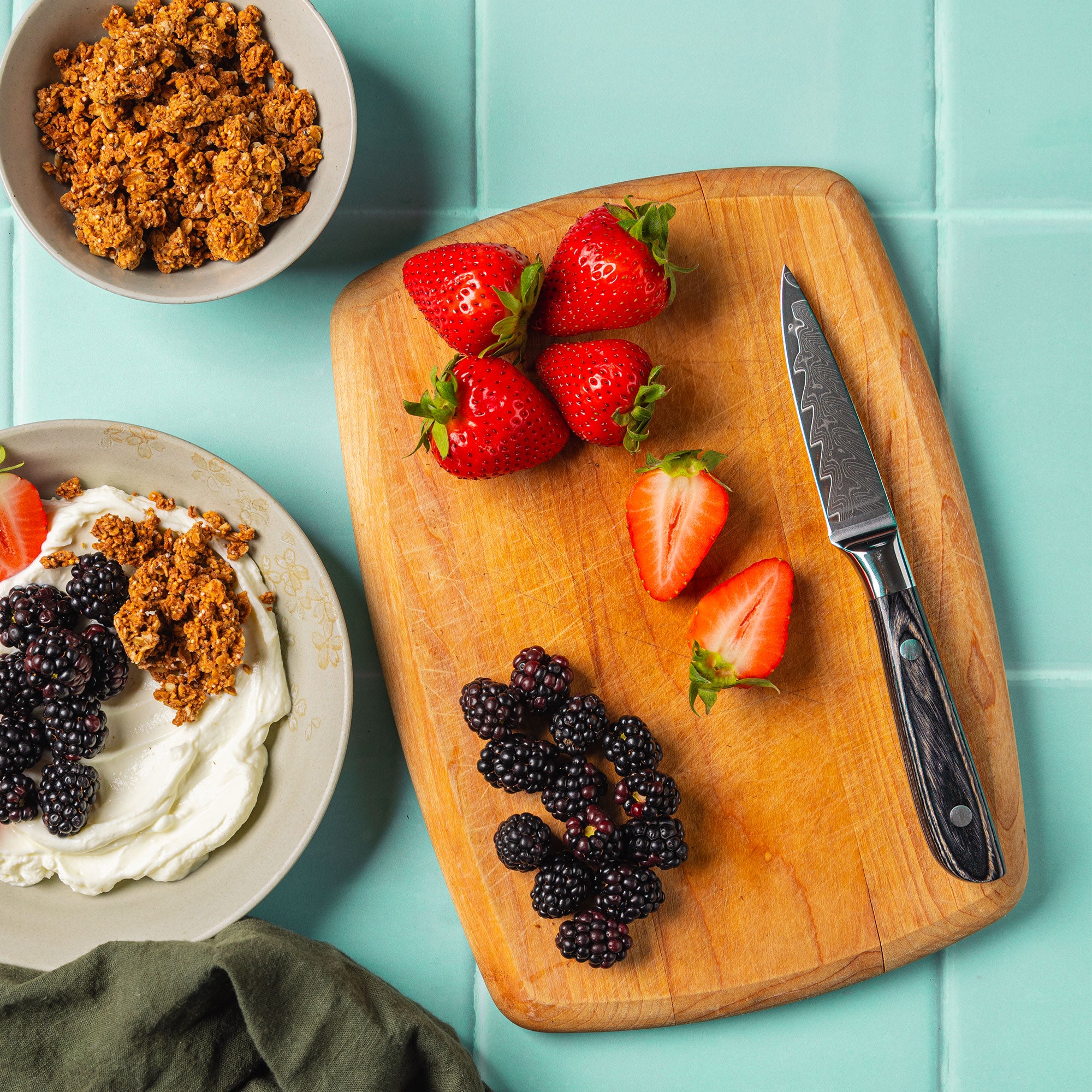 Messermeister Avanta Damascus paring knife displayed with fresh berries on cutting board
