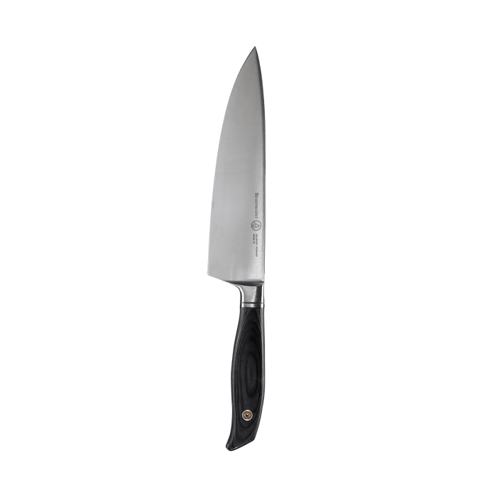 Messermeister Blacksmith 8-Inch Chef’s Knife featuring a hand-forged high-carbon stainless steel blade with a hammered blacksmith finish and an ergonomic ebony pakkawood handle
