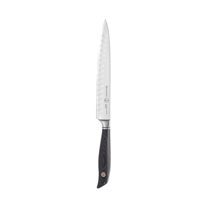Messermeister Blacksmith 9-Inch Kullens Carving Knife featuring a long, narrow high-carbon stainless steel blade with kullens granton indentations and a hammered blacksmith finish, paired with an ergonomic ebony pakkawood handle for smooth, precise slicing of meats and roasts
