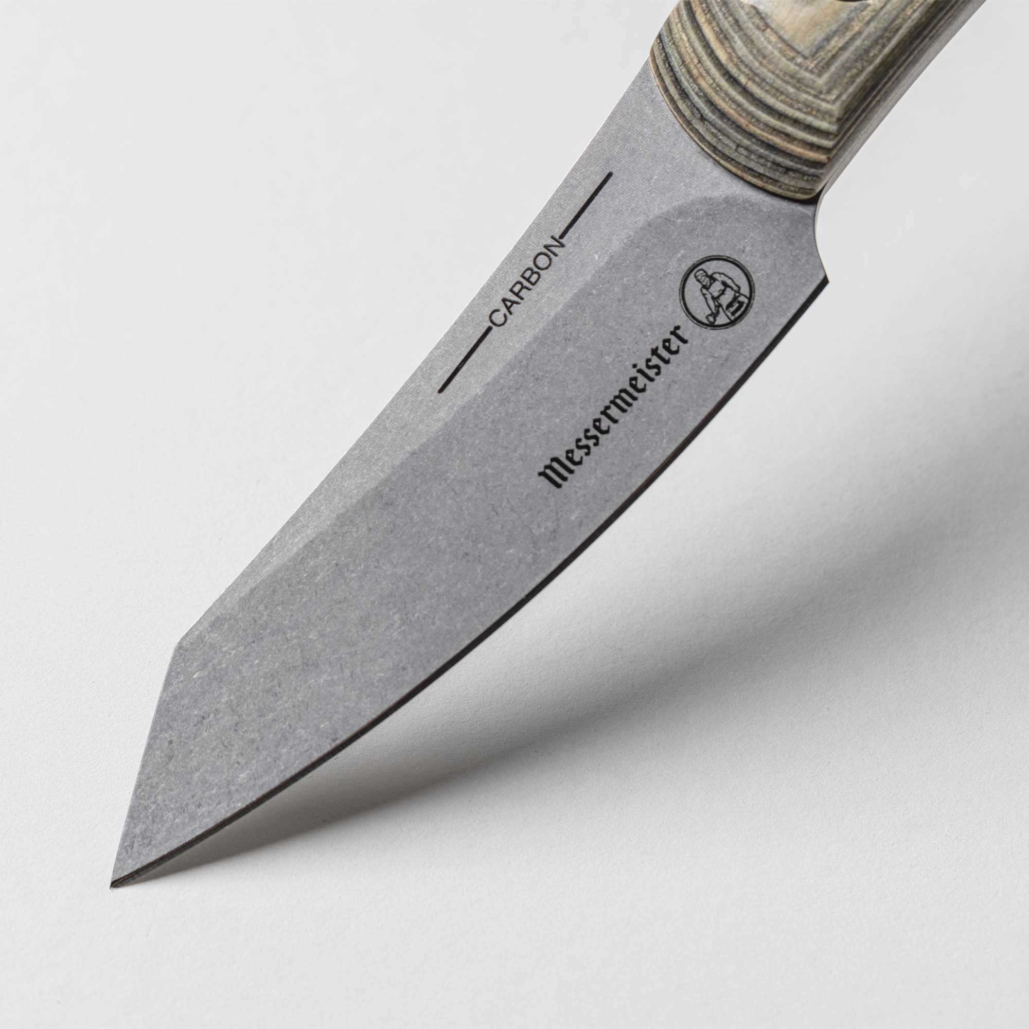 A close up view of the reinforced tip and crowned spine on the 3.5 inch Carbon Paring Knife 
