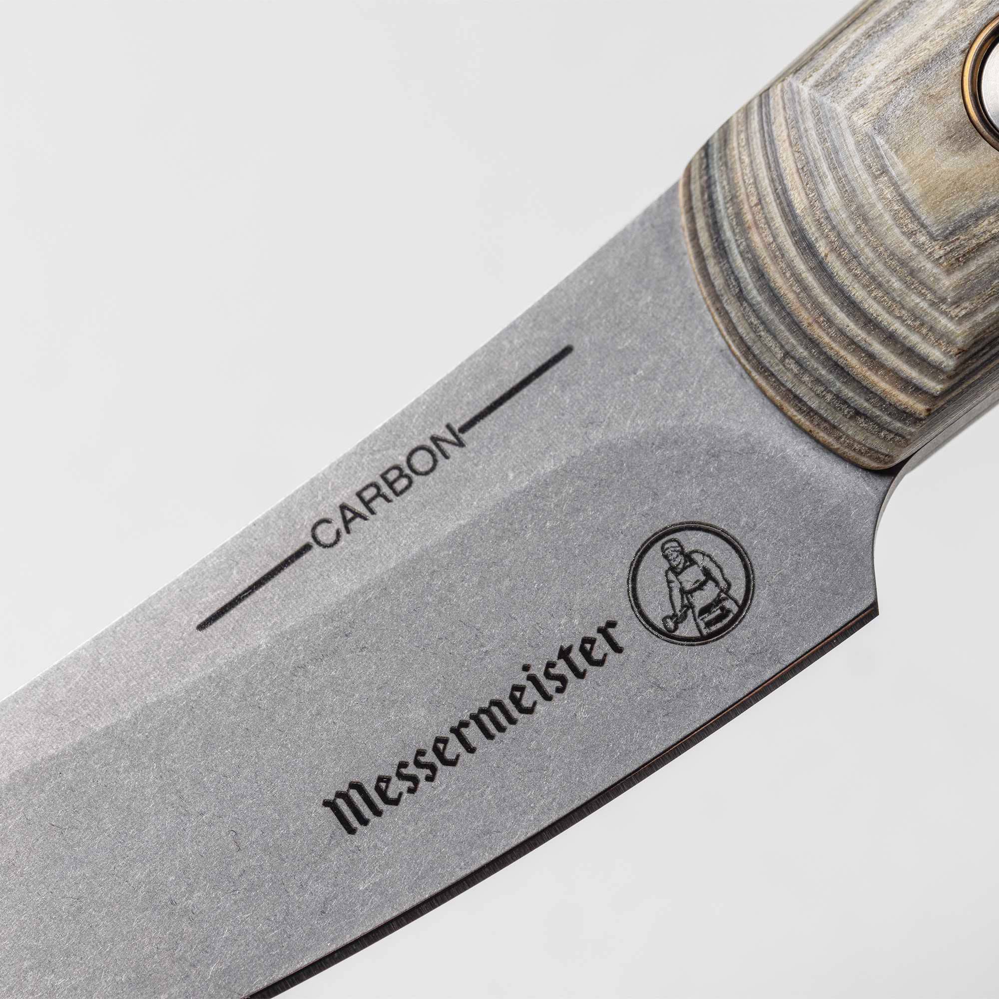 A close up view of the heel and logo on the 3.5 inch Carbon Paring Knife 