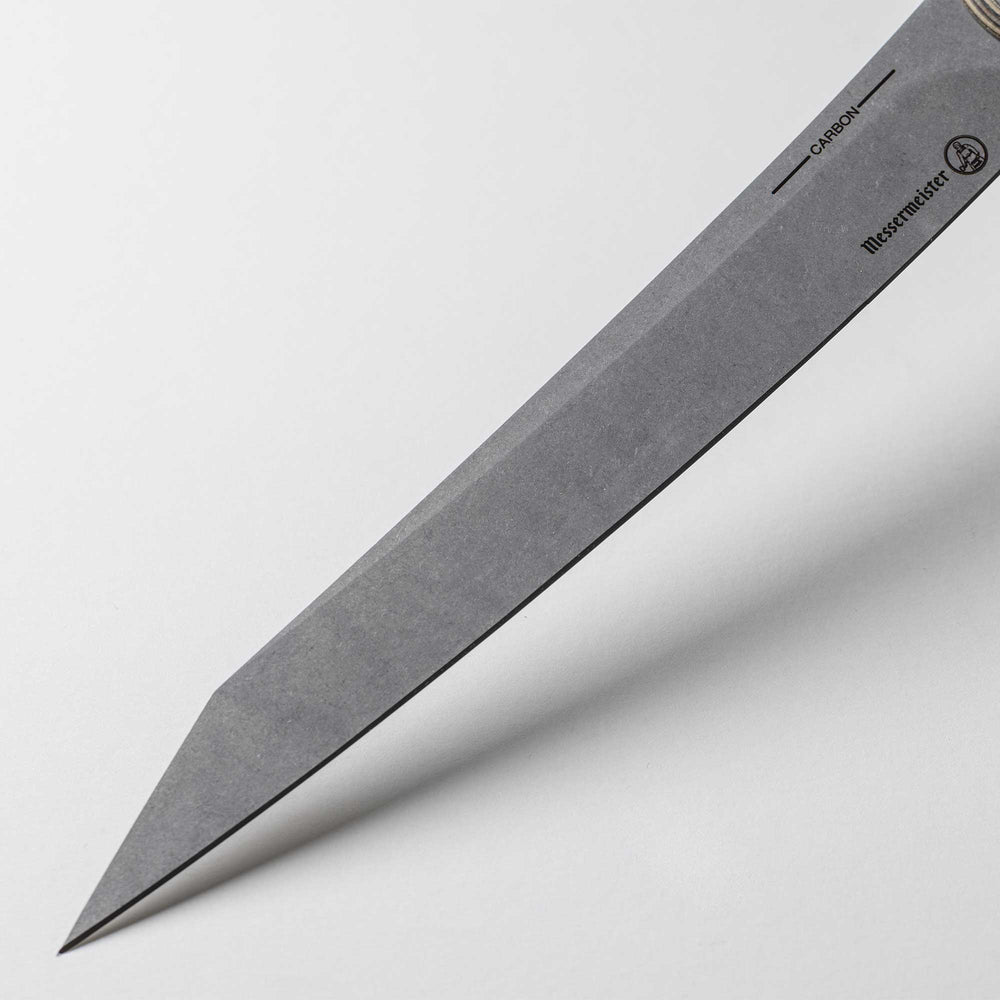 A close up view of the reinforced tip and crowned spine on the 9 inch Carbon Slicing Knife 