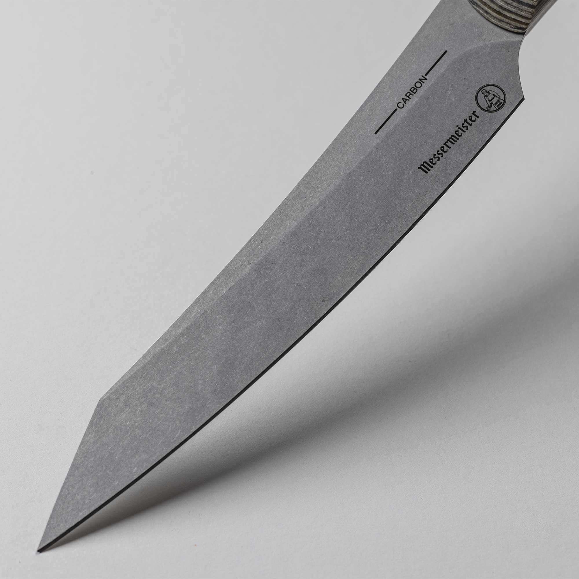 A close up view of the 6 inch Carbon Utility Knife blade with crowned spine and reinforced tip