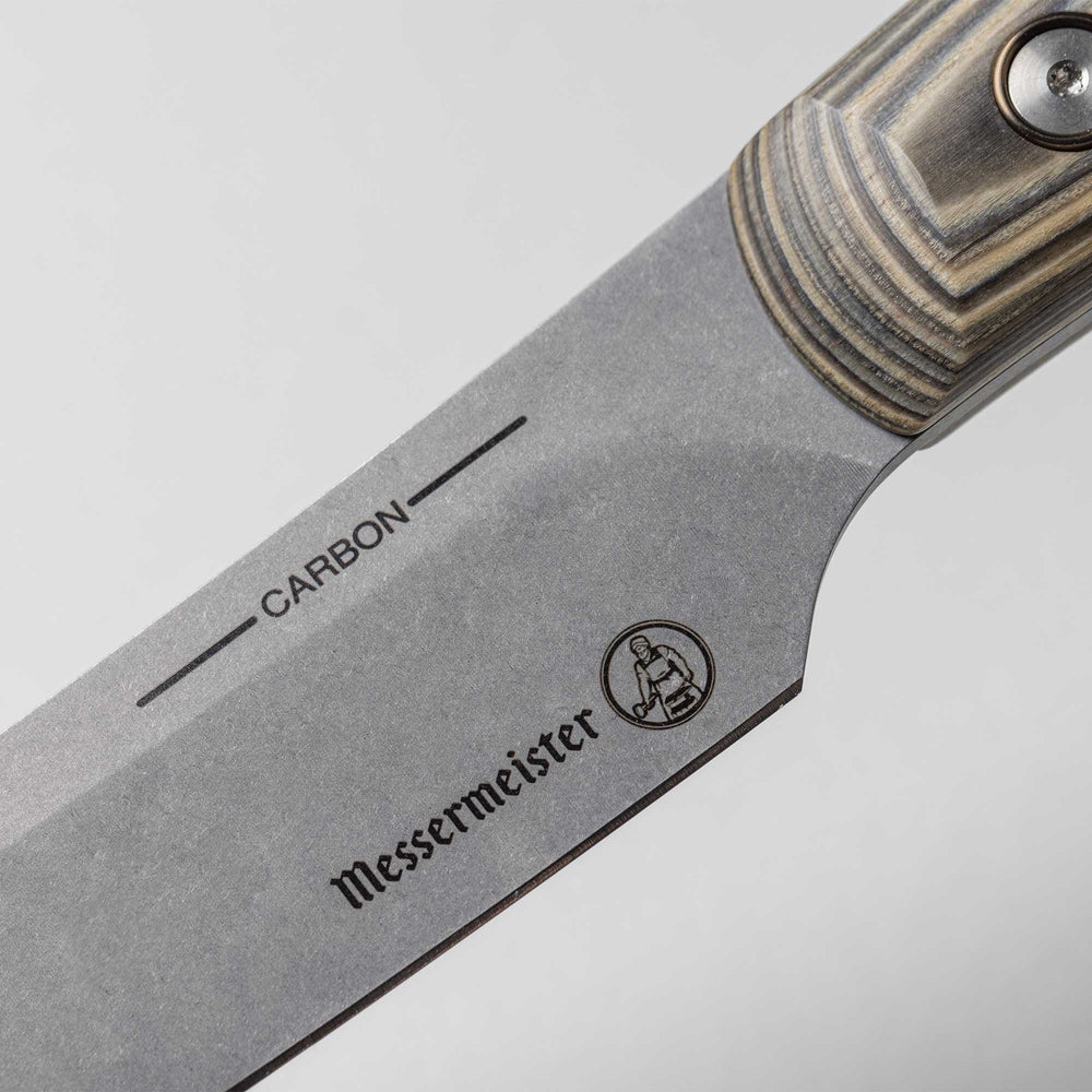 A close up view of the 6 inch Carbon Utility Knife heel and logo