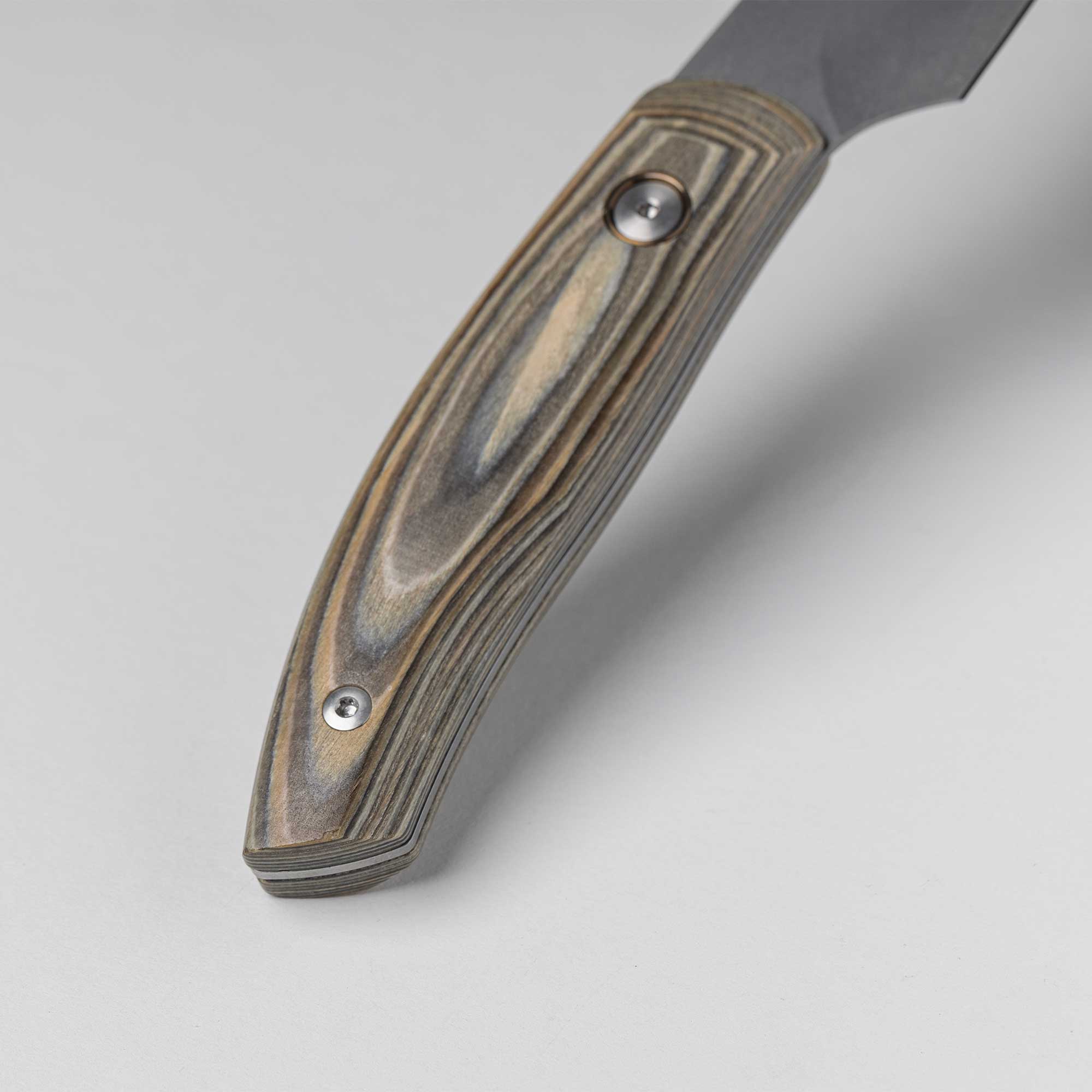 A close up view of the Spanish hardwood handle with 2 rivets on the 6 inch Carbon Utility Knife 