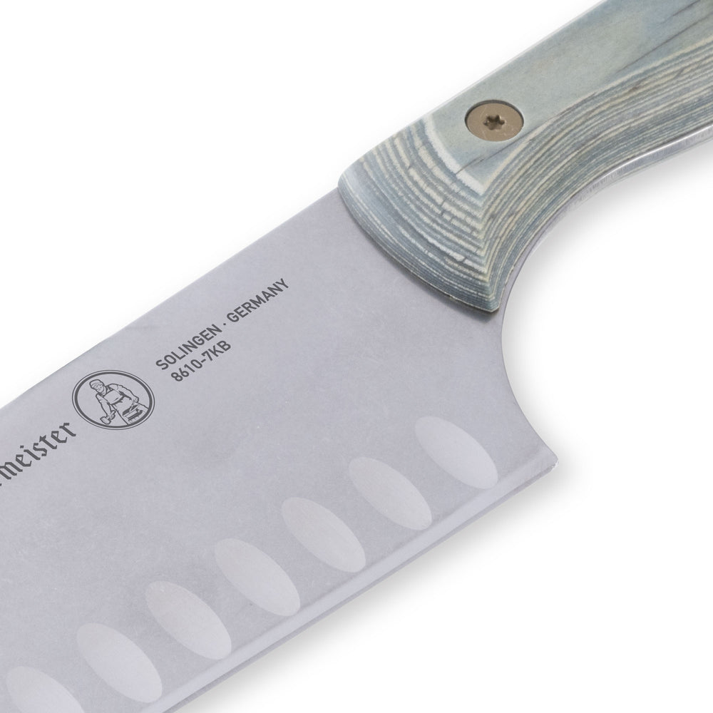 Close-up of Messermeister Custom Blue 7-inch santoku knife heel highlighting blade base and granton stainless steel edge
