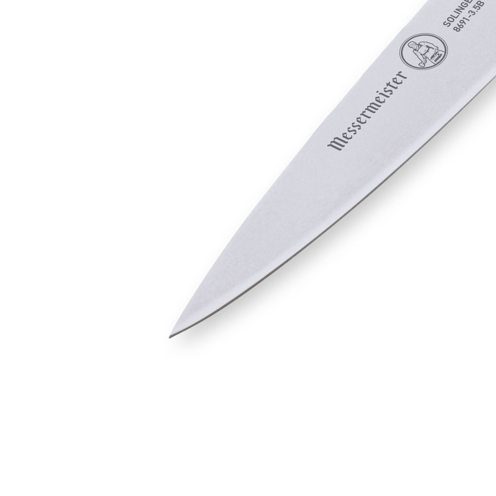 Close-up of Messermeister Custom Blue 3.5-inch paring knife tip highlighting sharp stainless steel cutting edge and precision point
