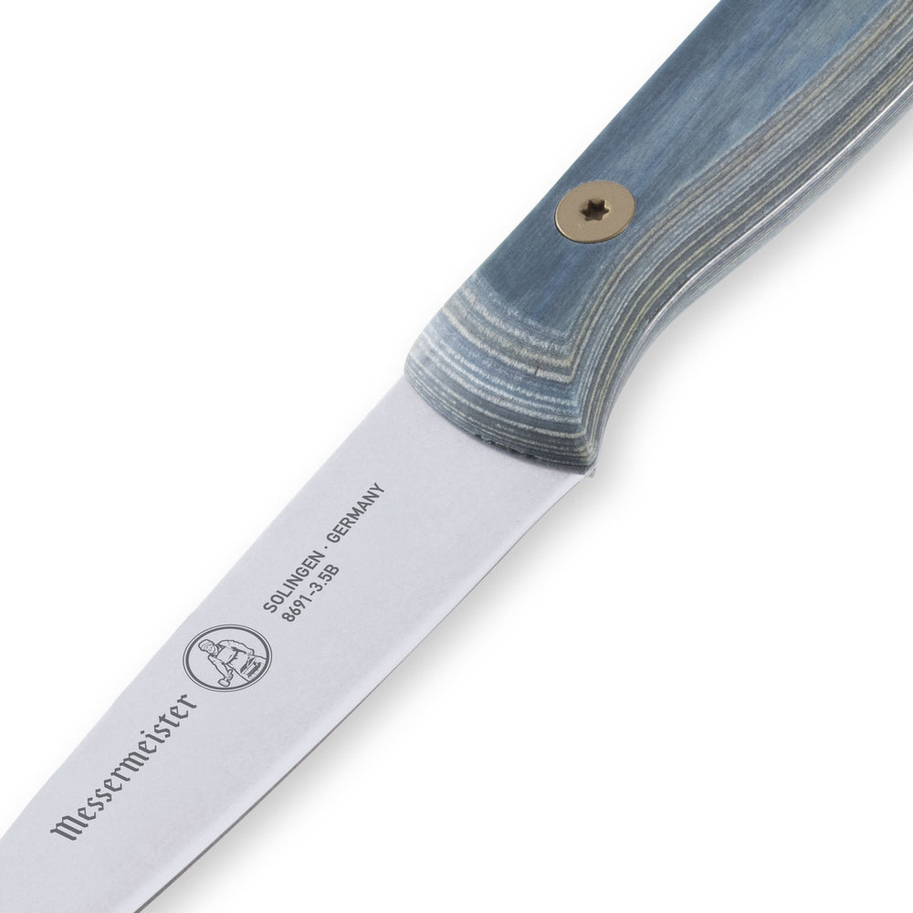 Close-up of Messermeister Custom Blue 3.5-inch paring knife heel highlighting blade base and polished stainless steel edge