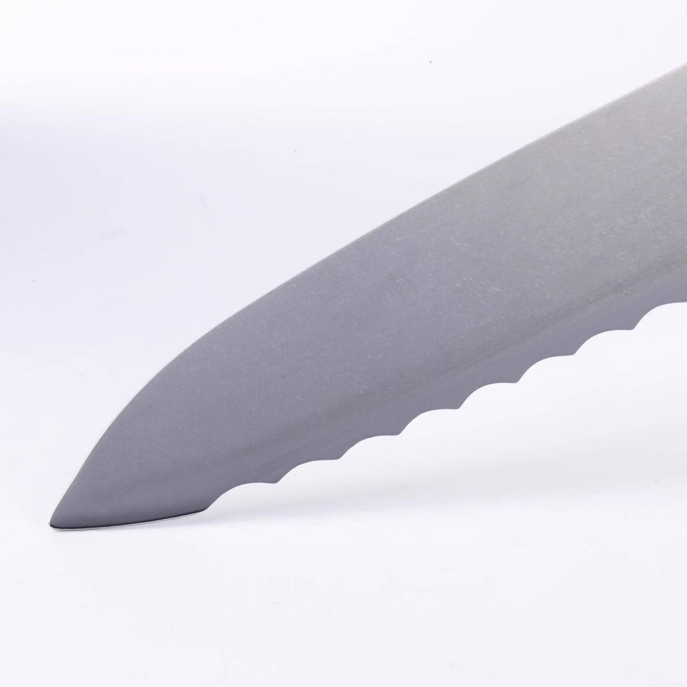 Close-up of Messermeister Custom Blue 8-inch scalloped offset knife tip highlighting scalloped serrated edge and stainless steel blade