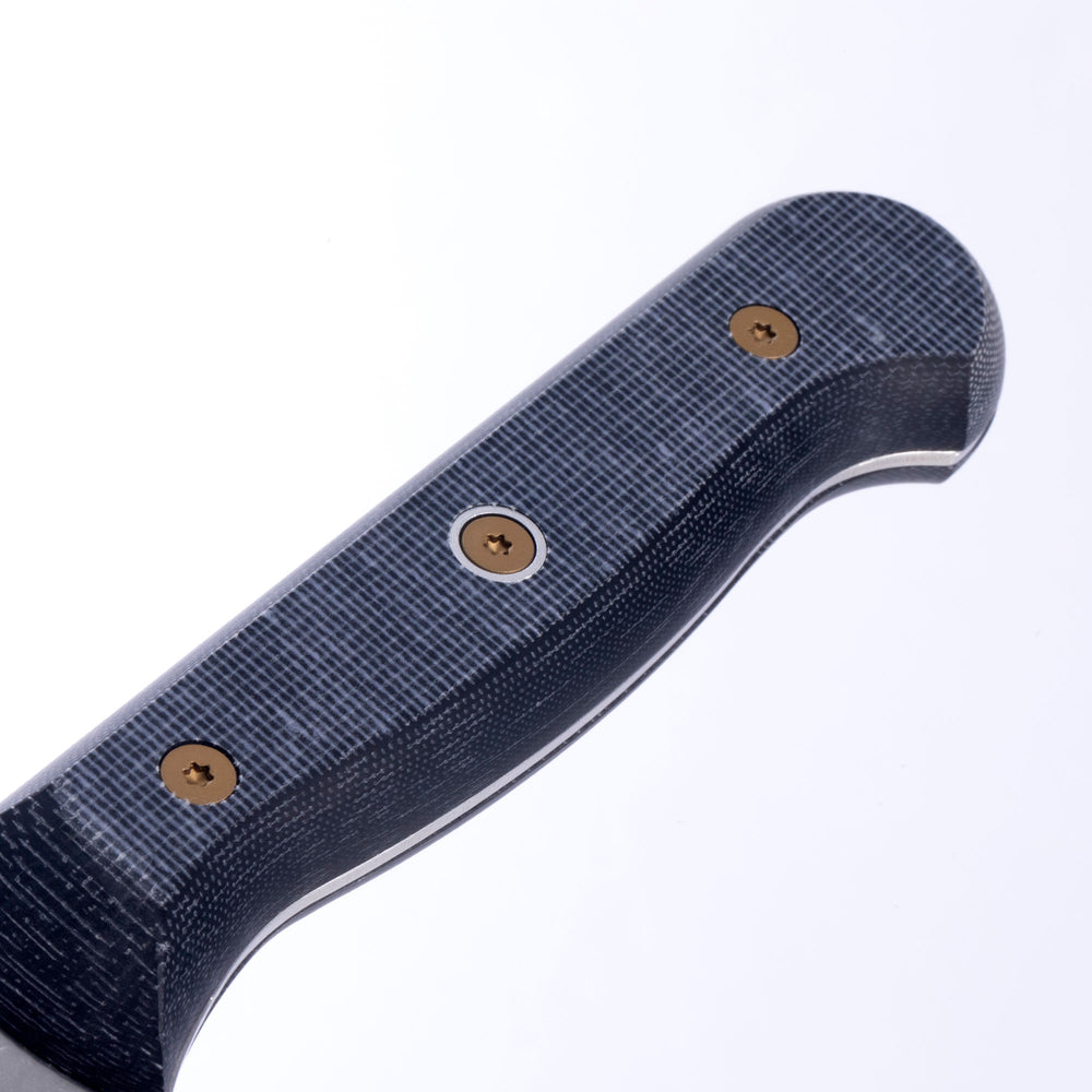 Close-up of knife handle made from linen Micarta highlighting ergonomic textured grip