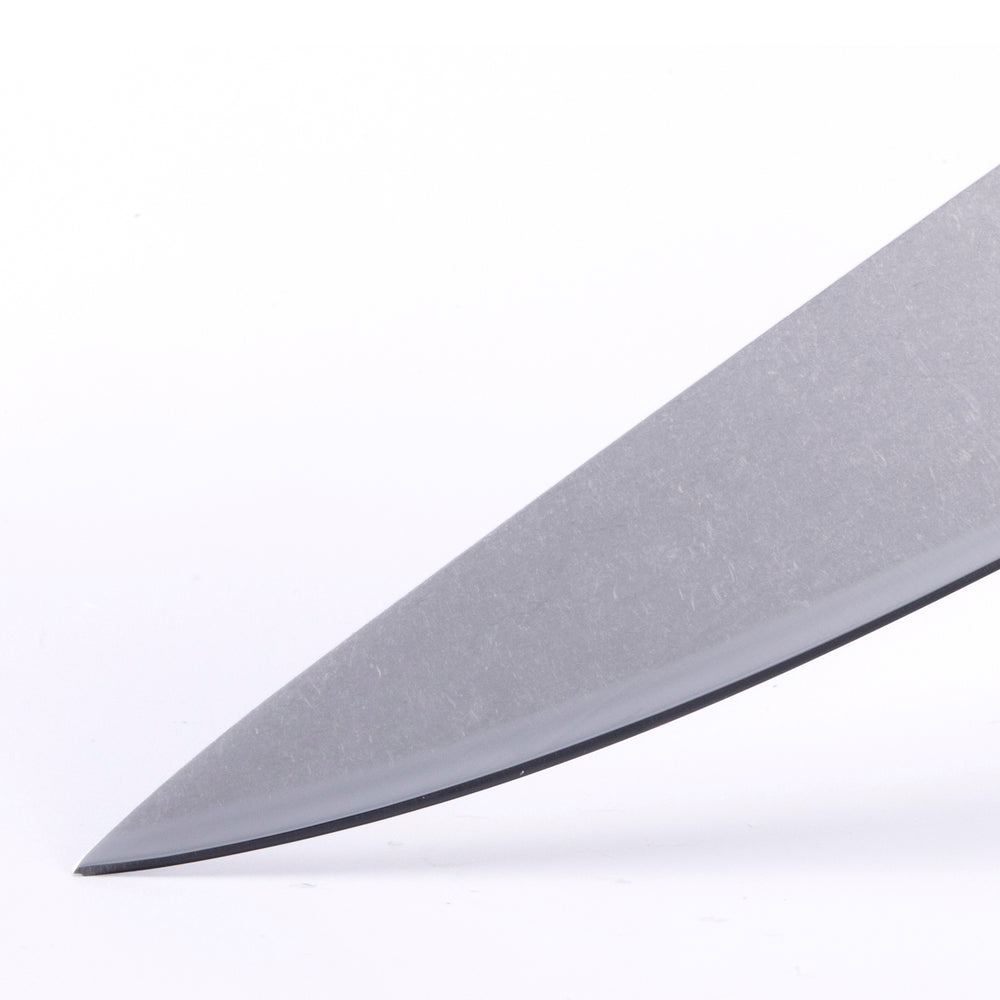Detail of Messermeister custom utility knife blade showing sharp precision edge and polished steel