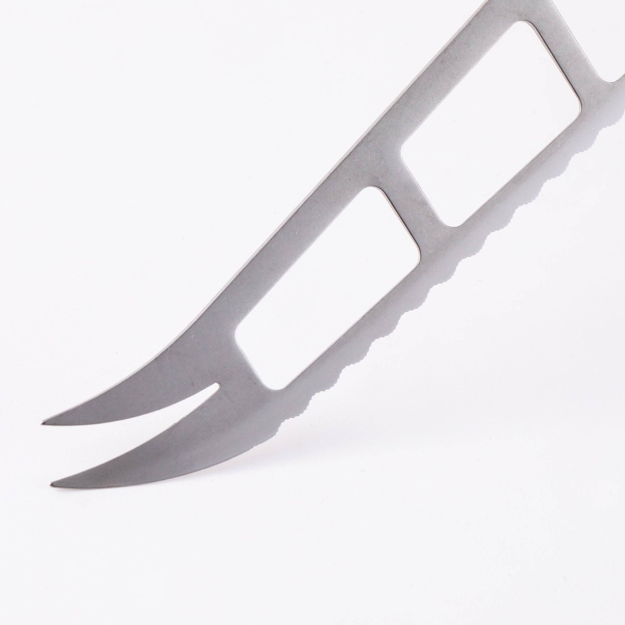 Close-up of the forked cheese prongs on the tip of the Messermeister Custom Red 5-inch Cheese & Tomato Knife with serrated stainless steel blade detail