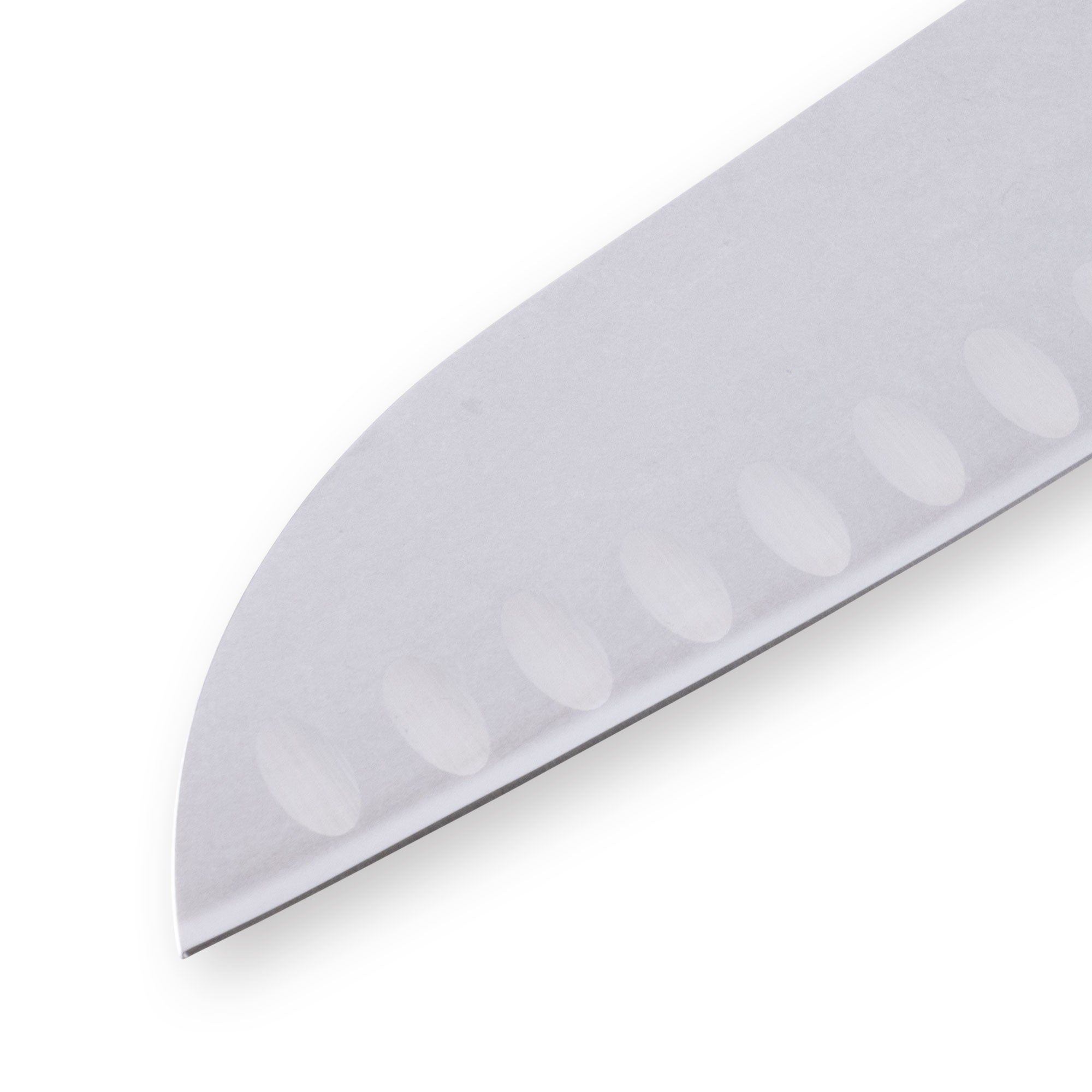 Close-up of the tip of a 7-inch Messermeister Custom Red Kullens Santoku knife, showing the polished stainless steel blade tapering to a fine point with granton edge detail