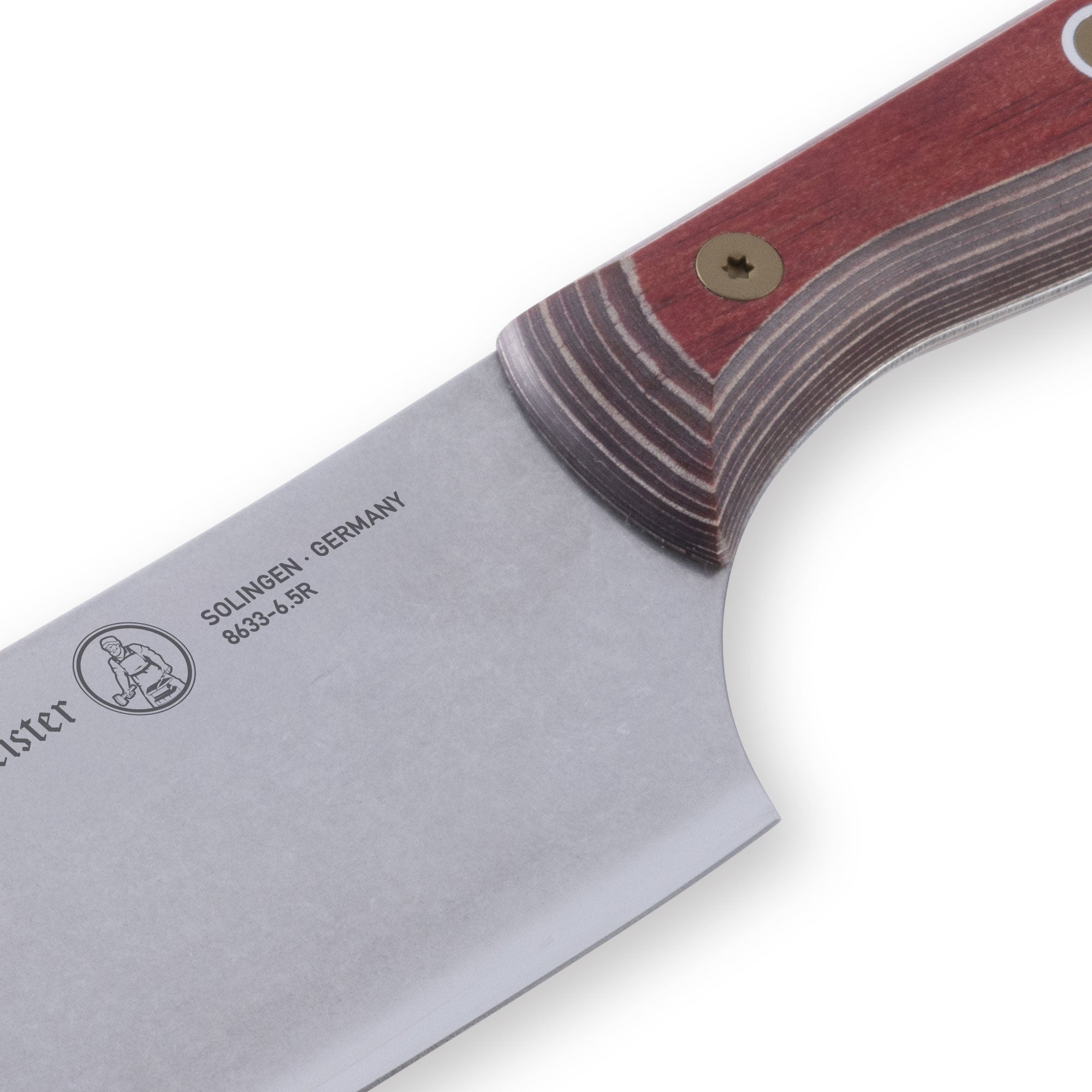 Close-up of the heel of a 6.5-inch Messermeister Custom Red Nakiri knife, showing the thick base of the straight stainless steel blade meeting the bold red ergonomic handle