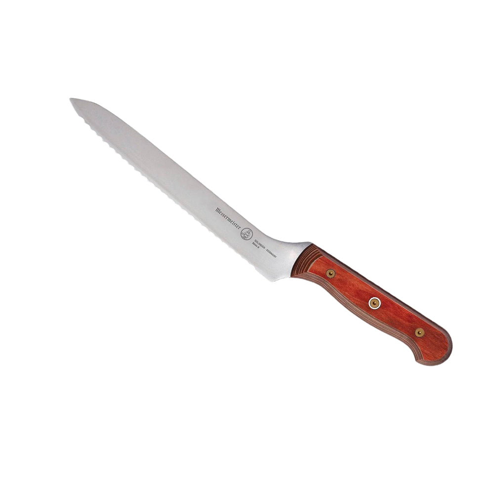 8-inch Messermeister Custom Red scalloped offset knife shown at an upward angle, highlighting the serrated stainless steel blade, offset profile, and bold red ergonomic handle