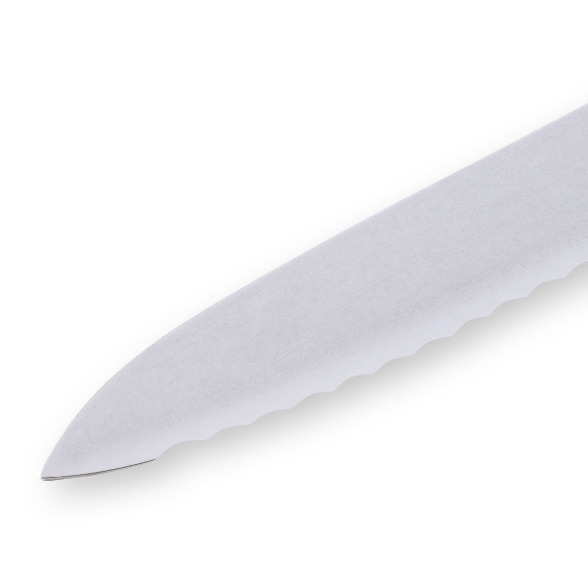 Close-up of the pointed tip of an 8-inch Messermeister Custom Red scalloped offset knife, showing the fine serrated stainless steel edge and precise tapered blade end