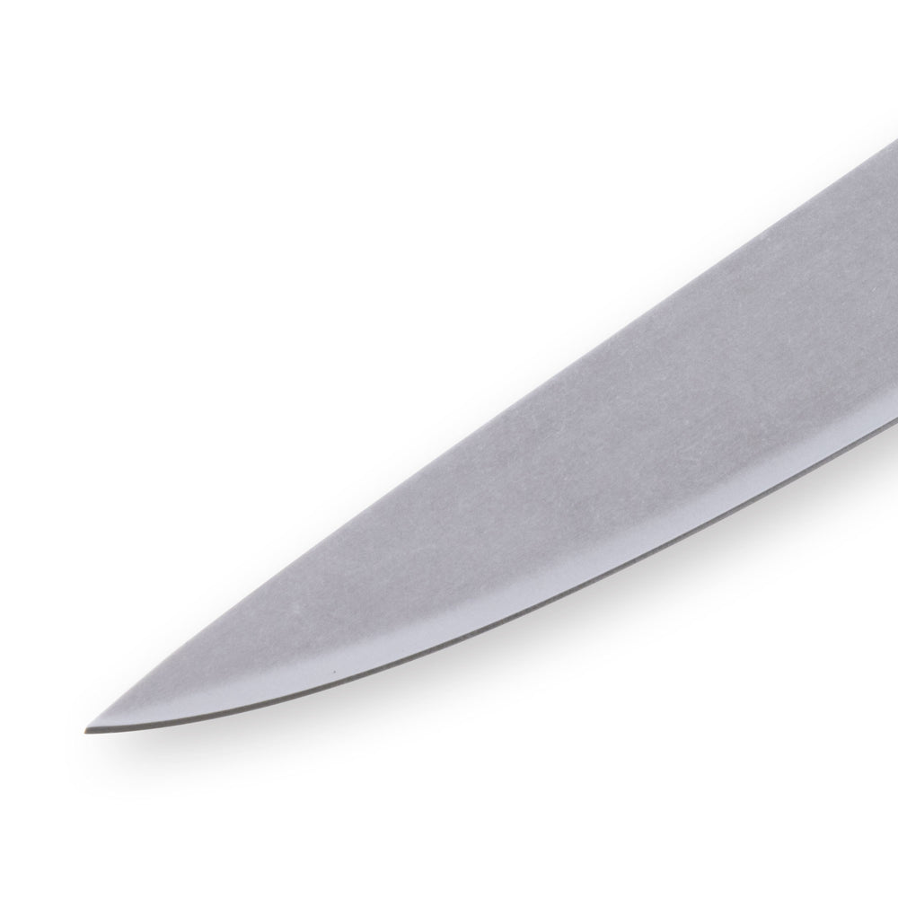 Close-up of the tip of a 6-inch Messermeister Custom Red utility knife, showing the fine tapered point and polished stainless steel blade edge