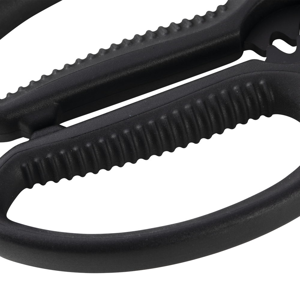 Esther Choi 7-inch push button take-apart precision shears close-up of the ergonomic handle design, highlighting textured grip, stainless steel construction, and precision-balanced build for comfortable and controlled kitchen cutting