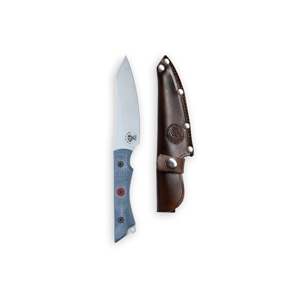 INR x Messermeister Overland Utility Knife with denim micarta handle sitting alongside a leather sheath that fits the blade
