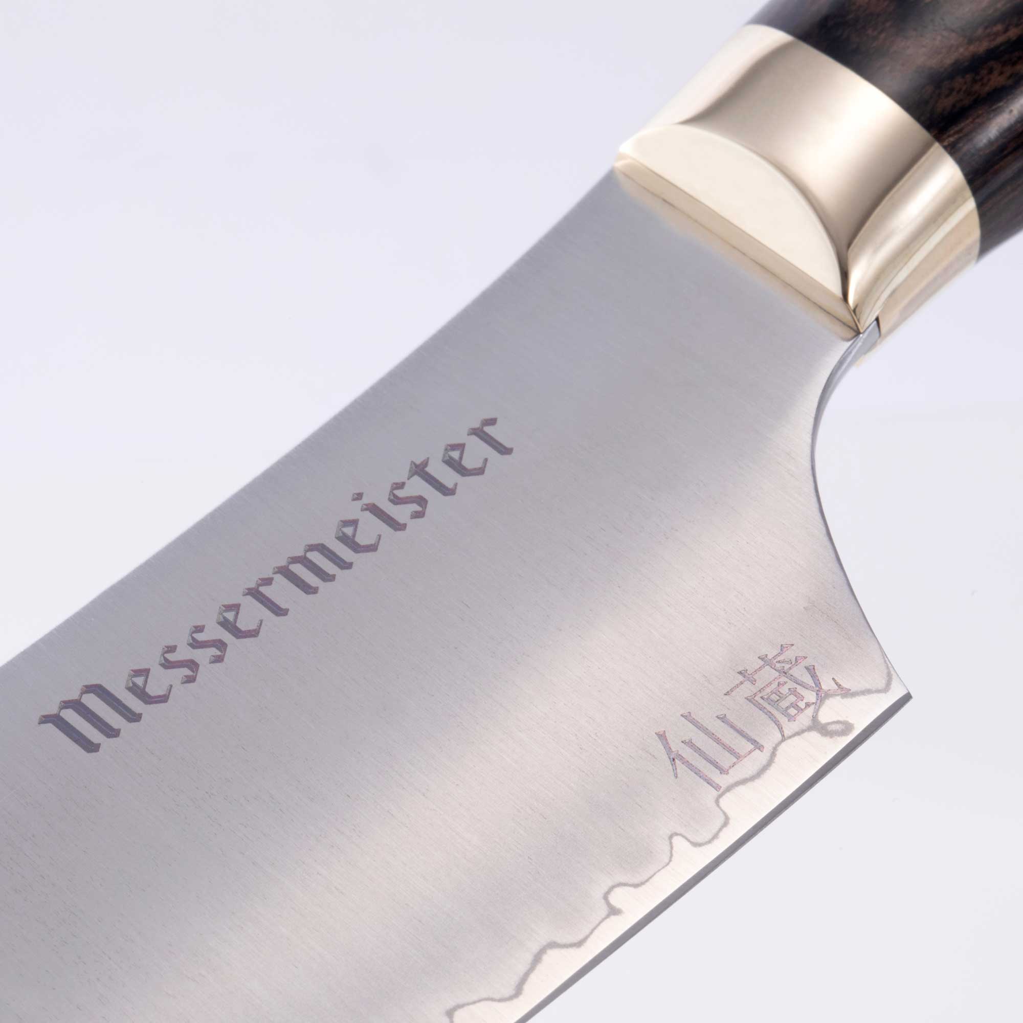 Messermeister Kawashima Nakiri Knife 6.5 inch close up on blade and gold bolster