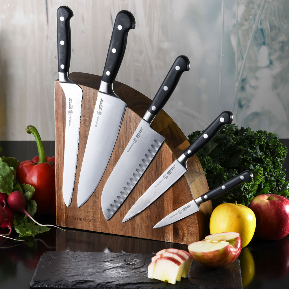 Messermeister Meridian Elite 6 piece Block Set - Quarter moon magnetic wooden block with 5 knives attached on one side all with triple rivet black handles. Blades are exposed on the block surface in an arc 