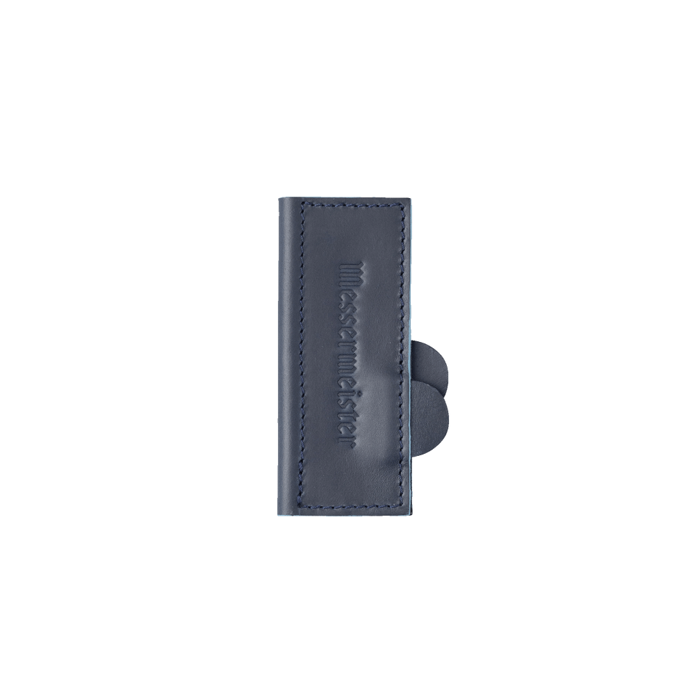 Messermeister 4 inch Midnight Navy Leather Magnetic Edge Guard Soft Rubber Magnets to Secure Knife close up on logo