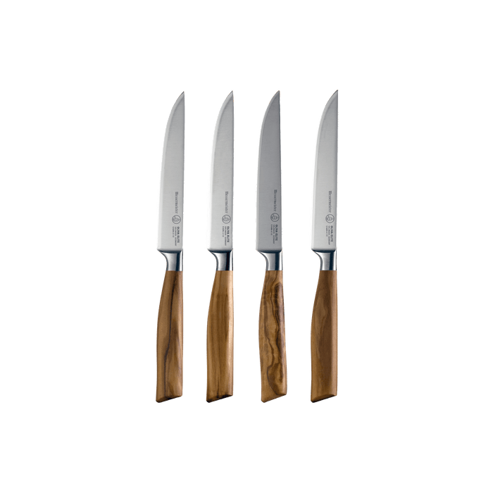 A set of four Oliva Elite fine edge steak knives with olive wood handles and stainless steel blades.