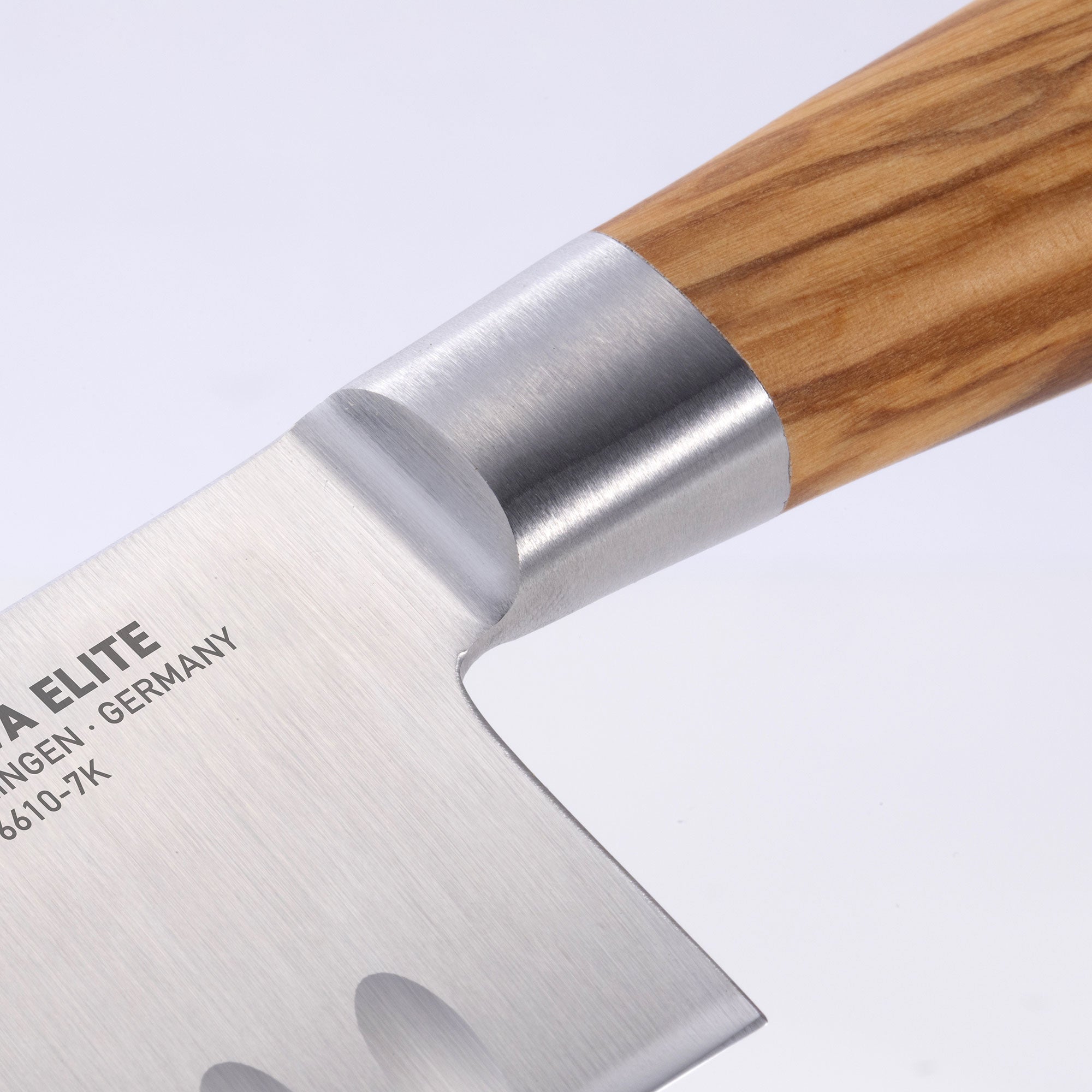 Close up of the Oliva Elite 7 inch Santoku bolster and heel