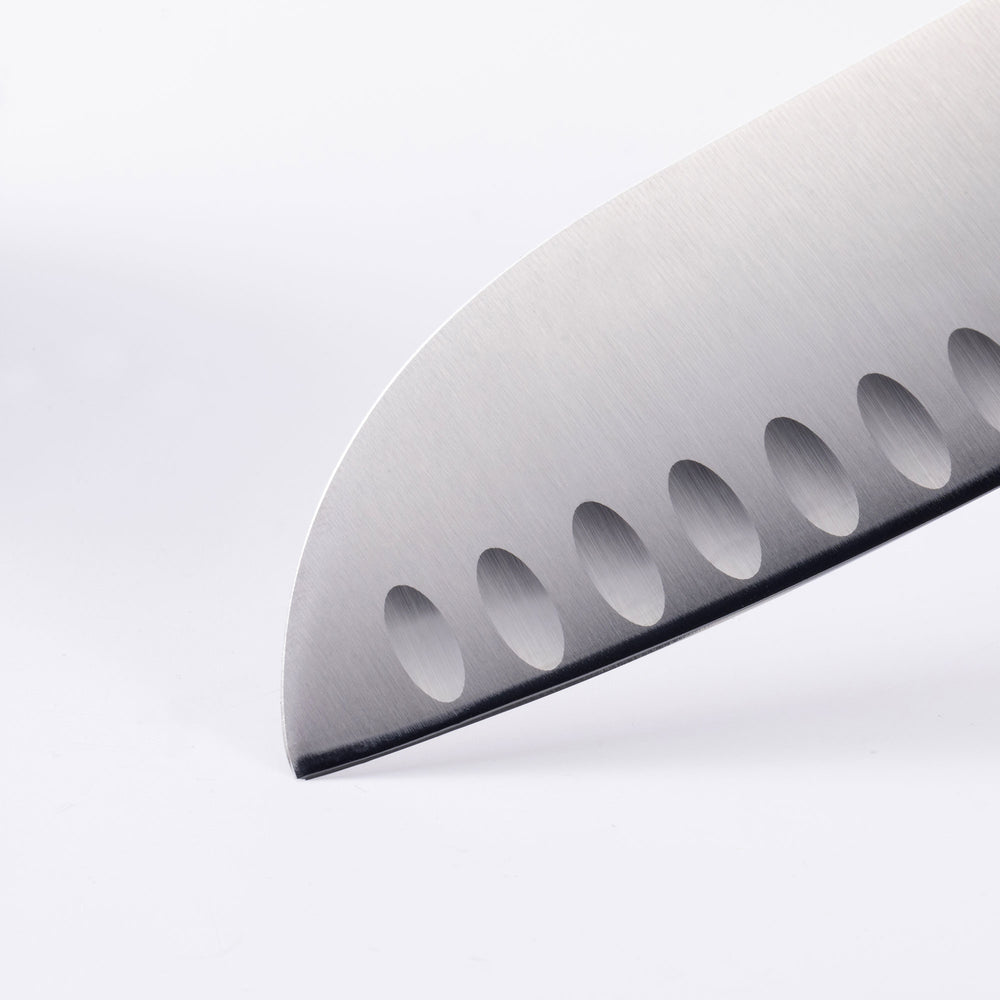 Close up of the Oliva Elite 7 inch Santoku knife tip with kullens