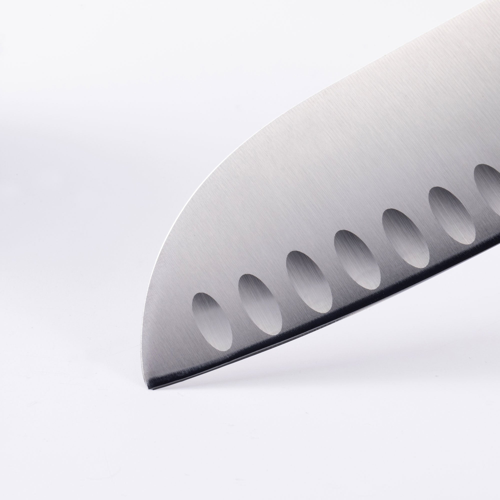 Close up of the Oliva Elite 7 inch Santoku knife tip with kullens