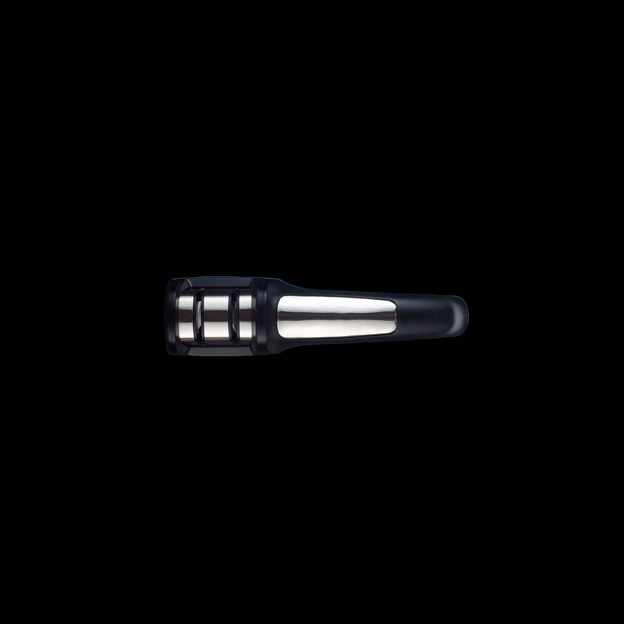 A top view of the Messermeister Pull Through Sharpener. Showing the 2 slotted sharpening openings. Handle on the right.