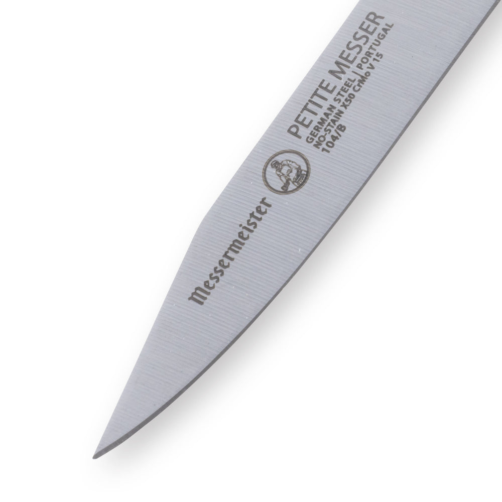 Blade detail of Messermeister Petite Messer black 3 inch clip point parer showing precision straight edge and tip